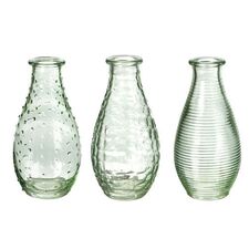 Small glass bud vases for single stem floral arrangements and wedding tables