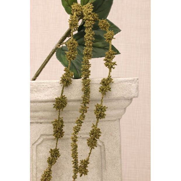 A dark green artificial Astrantia flower with a tassel.